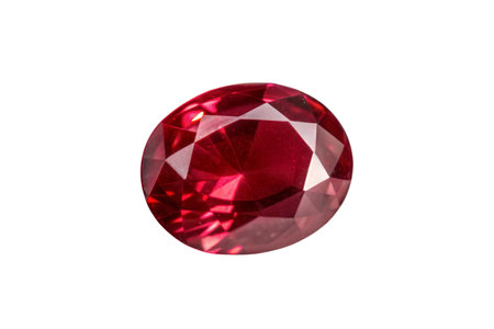 Close-up shot of a brilliant, red gemstone, exhibiting intricate facets and rich color against a...
