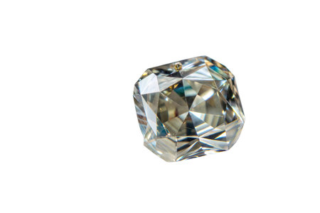 Close-up shot of a single,faceted diamond gemstone with brilliant sparkle against a black background.の写真素材