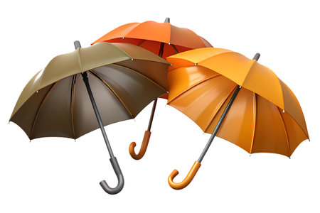 Three closed umbrellas in orange and brown,  floating against a black background.の写真素材