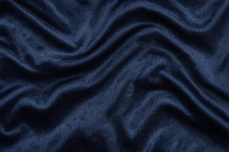 A high-resolution macro shot of midnight navy blue moire watered silk fabric, featuring elegant folds and a rich, lustrous texture.