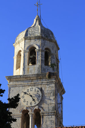 Cavtat clock tower in the evening sun in Croatia