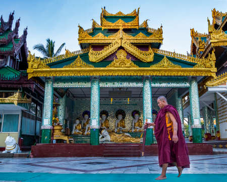 Yangon, Myanmar, 9th November 2015: A monk walking to pray at the Shwedagon pagodaのeditorial素材