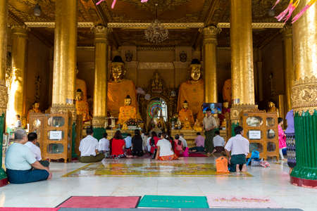 Yangon, Myanmar, 9th November 2015: The Shwedagon pagoda in Yangon is a very active temple where many people gather every day to prayのeditorial素材