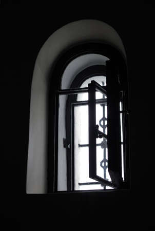 barred window in the thick wallの写真素材