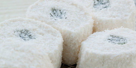 pieces of white rahat-lokum in a coconut crumb