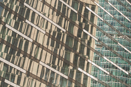 office building with abstract reflections on a glass facade