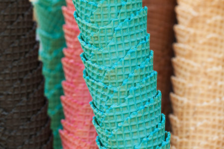 several multicolored delicious waffle cups for ice cream