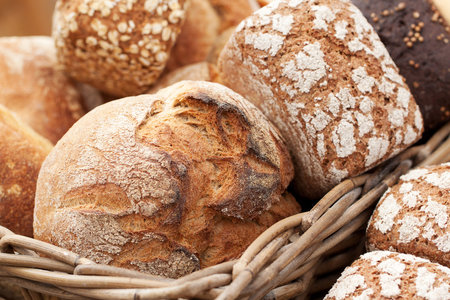 delicious fresh loaves of rye and wheat bread to lie in a basket in a shop window or in a bakery