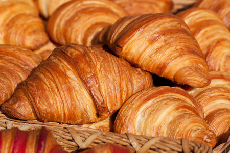 fresh delicious croissants prepared for breakfast in a cafe or restaurant