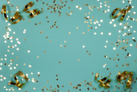 festive blue background with scattered golden stars in highlights and serpentine curls in the...