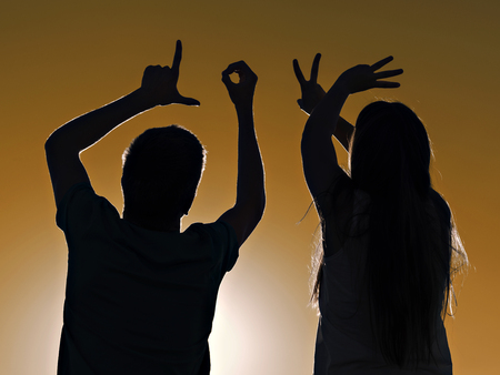 Two lovers teens, writing with his hands, loveの写真素材