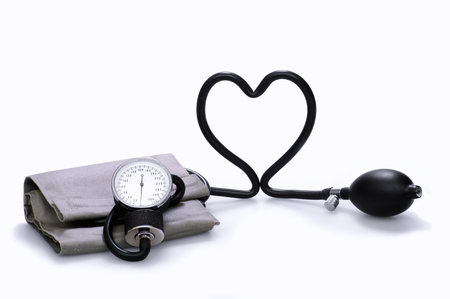 Sphygmomanometer that forms a heart, on a white backgroundの写真素材