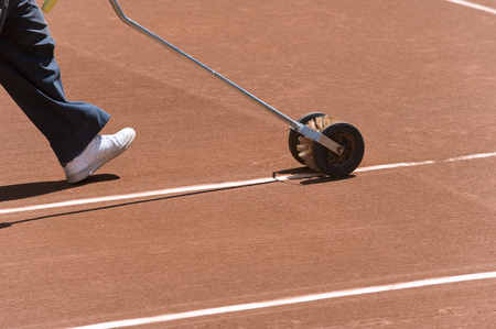 Rolling brush for cleaning the lines of the tennis courtsの写真素材