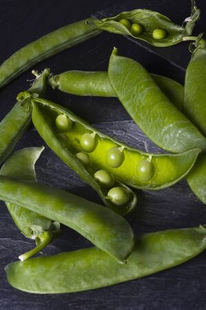 Peas on a bed of slateの写真素材