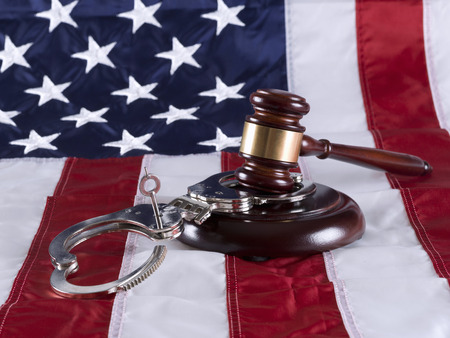 Gavel, handcuff and American flagの写真素材