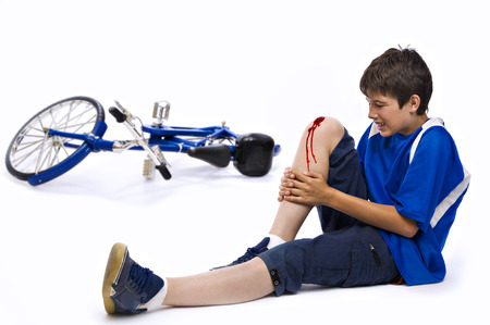 Young man who has had an accident in bicycleの写真素材