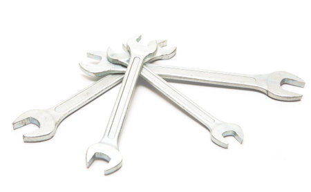 Four silver keys on a white background