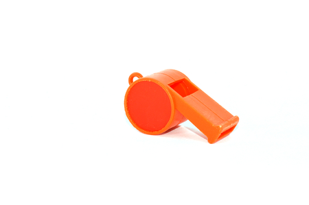Orange whistle isolated on a white backgroundの写真素材