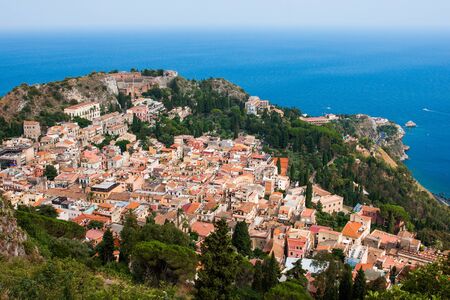 Aerial view of the Taormina city, with the ancient greek amphitheatre, Sicily island, Italyの写真素材