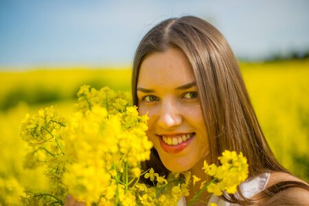 country girl in a good mood walks in a raps fieldの写真素材