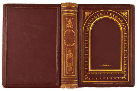 brown, old book with gilded ornament isolated on whiteの写真素材