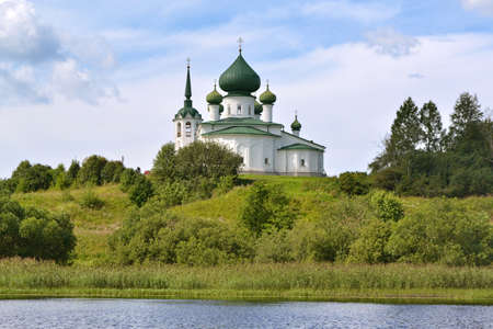 lonely church on the bank of the riverの写真素材