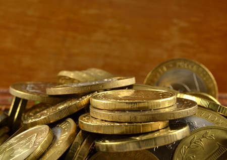 background with a bunch of gold coins close-upの写真素材