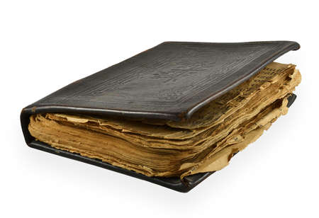 Old Bible with yellowed pages isolated on white backgroundの写真素材