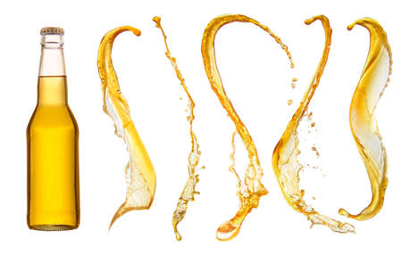 bottle of beer and beer splashes isolated on white backgroundの写真素材
