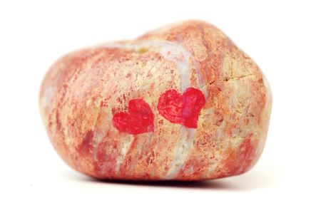Stone with hearts. Isolated over white backgroundの写真素材