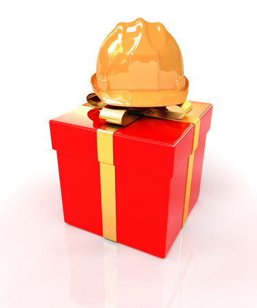 hard hat on a red gift on a white backgroundの写真素材