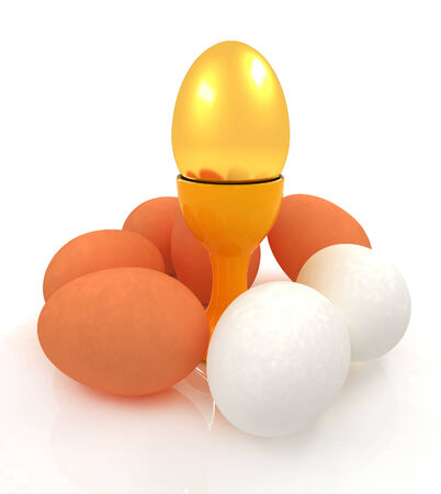 Eggs and gold easter egg on egg cups の写真素材