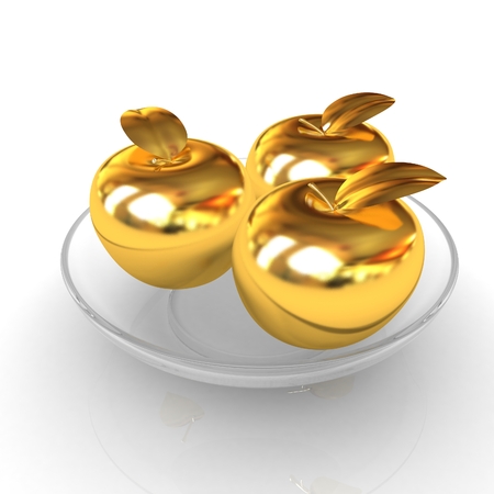 Gold apples on a plateの写真素材