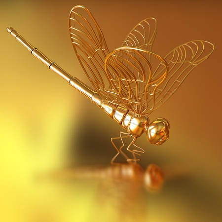 Gold dragonfly on a gold backgroundの写真素材