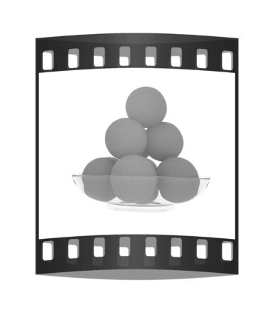 Oranges on a glass plate on a white background. The film stripの写真素材