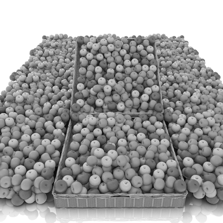 Wicker basket full of apples isolated on whiteの写真素材