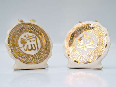 Arabic calligraphy  of Allah  Islamic God  on the right and  Prophet Muhammad transliterated as の写真素材