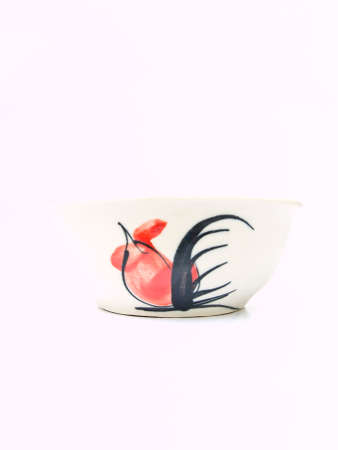 A white ceramic bowl with a chicken pattern  from Lampang, Thailandの写真素材