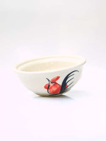 A white ceramic bowl with a chicken pattern  from Lampang, Thailandの写真素材