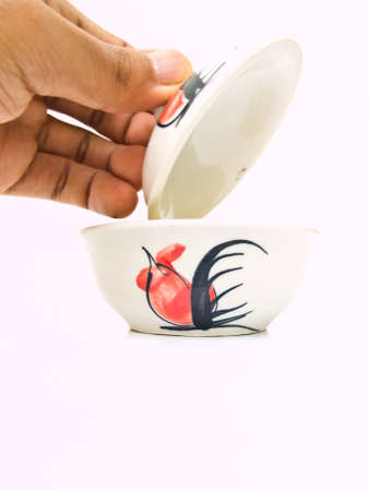 A white ceramic bowl with a chicken pattern  from Lampang, Thailandの写真素材