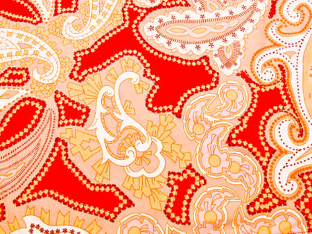 Red artistic batik fabric as backgroundの写真素材