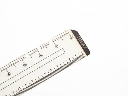 Closeup of used plastic ruler isolated on white backgroundの写真素材