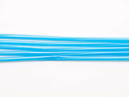 Light blue straws isolated on white back groundの写真素材