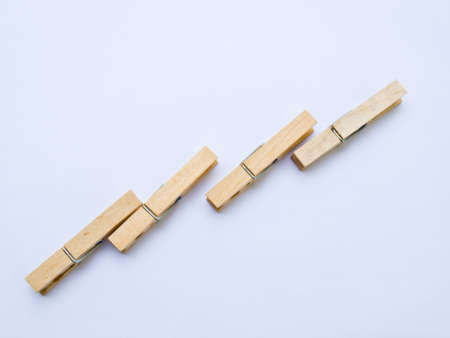 Wooden clothes clips isolated on white back groundの写真素材