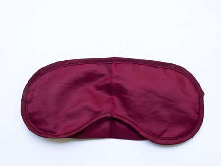 Crimson sleeping mask isolated on white backgroundの写真素材