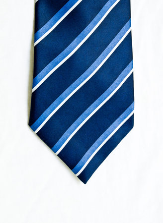 Striped blue and white tie isolated on white background 