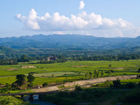 Paddy field and moutain view nearby Mae Suay reservoir, Chiang rai, Thailandの写真素材