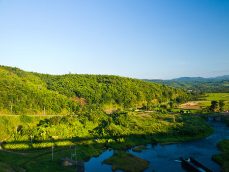 Paddy field and moutain view nearby Mae Suay reservoir, Chiang rai, Thailandの写真素材