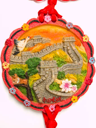 Great wall of China bas relief pendant isolated on white backgroundの写真素材