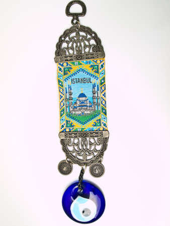 Turkish evil eye trinket isolated on white backgroundの写真素材